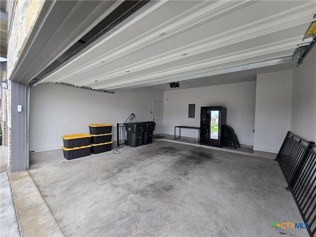 7808 Mcculloch Rd, Temple, TX 76502 - garage featuring electric panel and a garage door opener