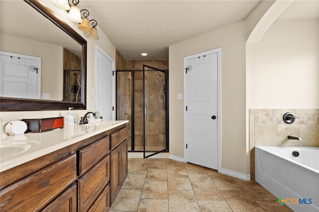 bathroom featuring plus walk in shower and vanity