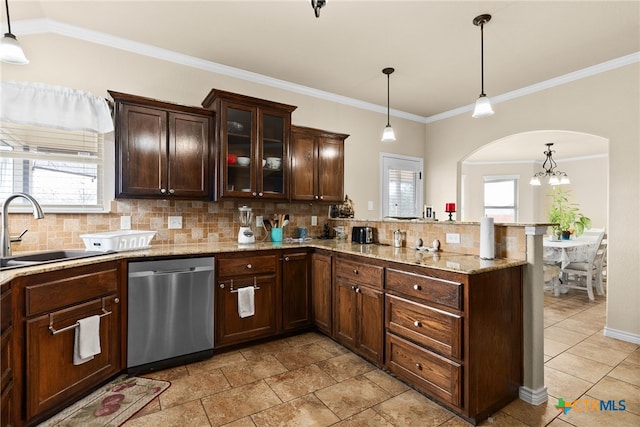 kitchen featuring hanging light fixtures, stainless steel dishwasher, plenty of natural light, and sink