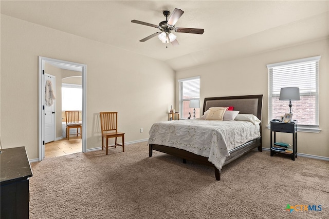 carpeted bedroom featuring ceiling fan and lofted ceiling