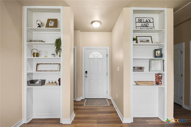 144 Slocum Dr, Canyon Lake, TX 78133 - entrance foyer featuring wood finished floors and baseboards