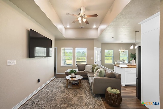 144 Slocum Dr, Canyon Lake, TX 78133 - living area featuring baseboards, dark wood-type flooring, ceiling fan, and plenty of natural light