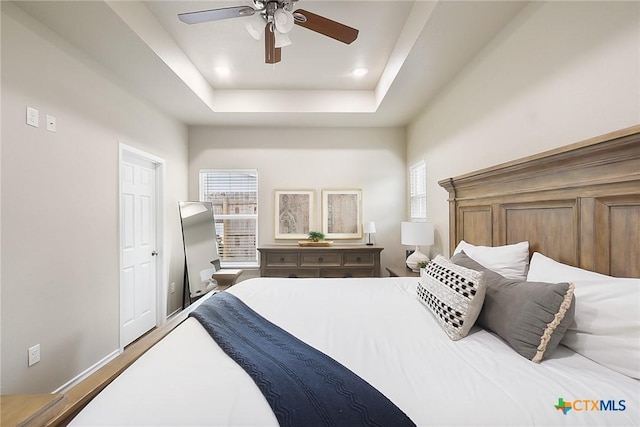 144 Slocum Dr, Canyon Lake, TX 78133 - bedroom with a ceiling fan and a raised ceiling