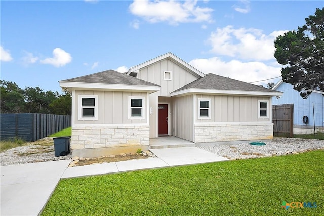 144 Slocum Dr, Canyon Lake, TX 78133 - view of front of house with stone siding, roof with shingles, and board and batten siding