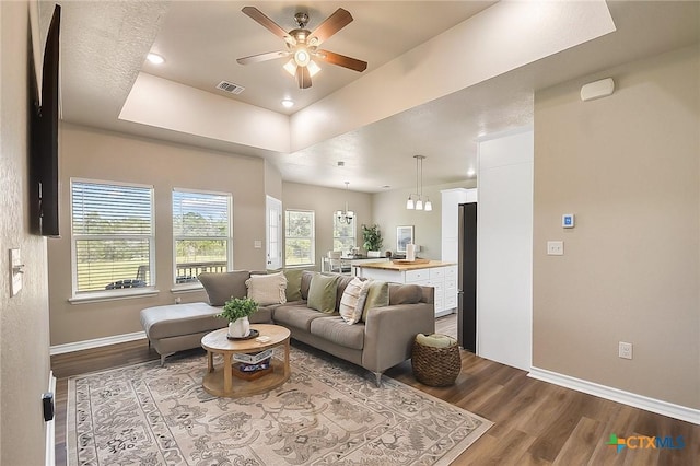 144 Slocum Dr, Canyon Lake, TX 78133 - living area with wood finished floors, ceiling fan, baseboards, a raised ceiling, and recessed lighting