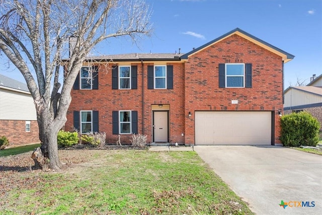 view of front of home featuring a garage and a front lawn