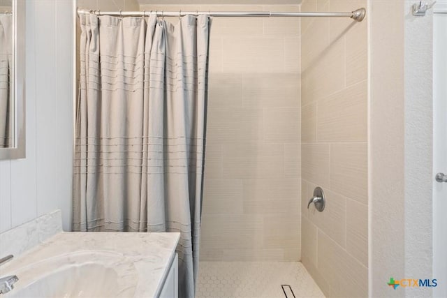 bathroom with vanity and a shower with shower curtain