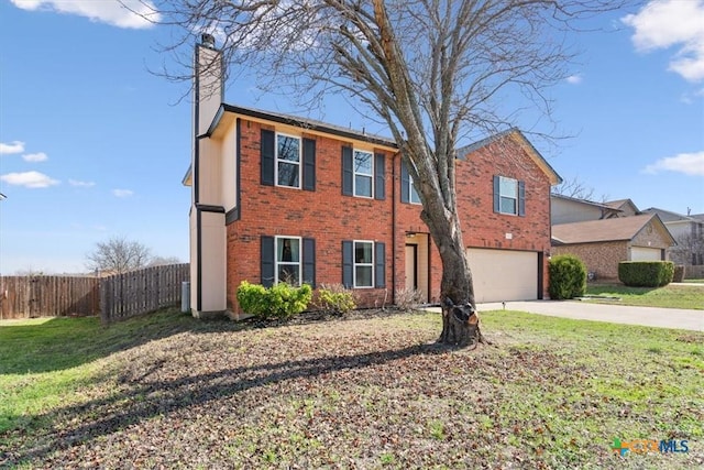 view of front of home with a garage and a front yard