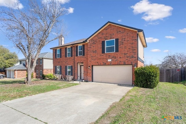 view of front of home featuring a garage and a front lawn