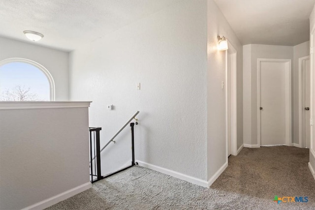 corridor featuring carpet flooring