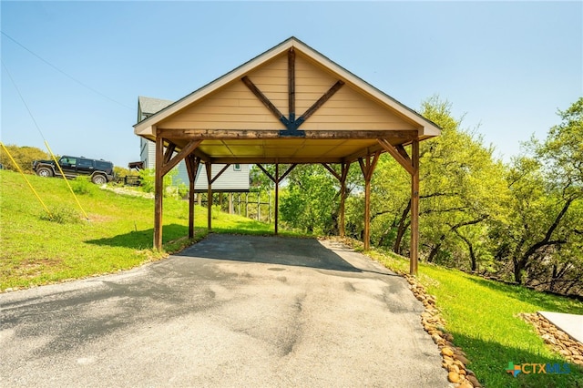 924 Kindersley St, Canyon Lake, TX 78133 - view of parking featuring asphalt driveway and a carport