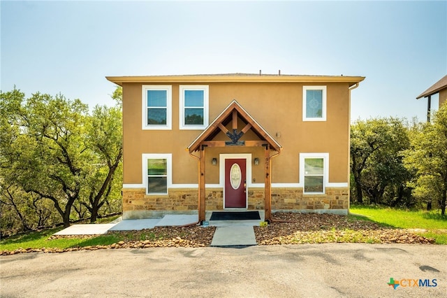 924 Kindersley St, Canyon Lake, TX 78133 - view of property featuring stone siding and stucco siding