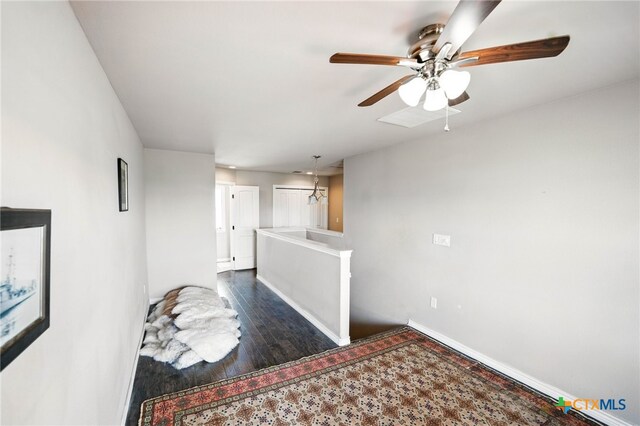 924 Kindersley St, Canyon Lake, TX 78133 - living area with baseboards, ceiling fan, and dark wood-style flooring