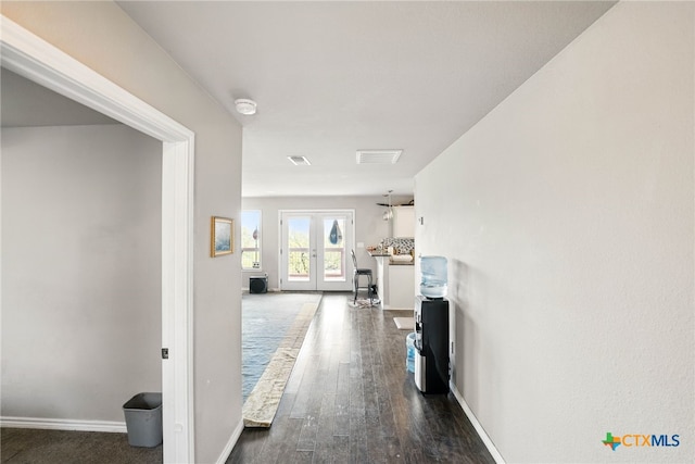 924 Kindersley St, Canyon Lake, TX 78133 - hall with french doors, baseboards, and dark wood finished floors