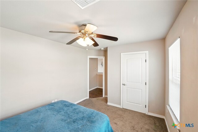 924 Kindersley St, Canyon Lake, TX 78133 - carpeted bedroom featuring baseboards and a ceiling fan