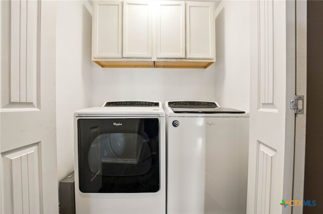 924 Kindersley St, Canyon Lake, TX 78133 - laundry area featuring washer and dryer and cabinet space