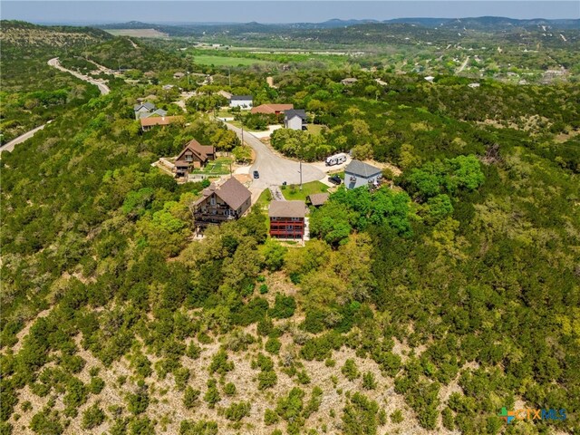 924 Kindersley St, Canyon Lake, TX 78133 - aerial view of property and surrounding area with a heavily wooded area