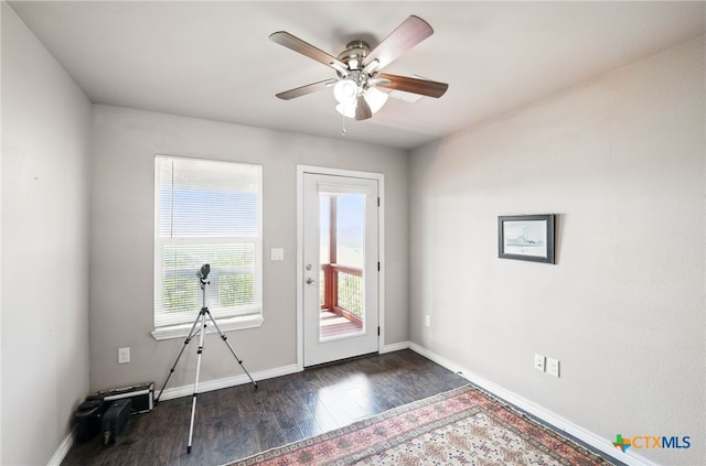 924 Kindersley St, Canyon Lake, TX 78133 - doorway to outside with dark wood finished floors, baseboards, and ceiling fan