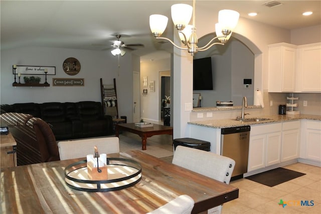 dining space featuring visible vents, ceiling fan with notable chandelier, arched walkways, recessed lighting, and light tile patterned flooring