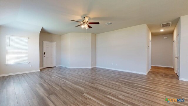 unfurnished room with ceiling fan and light wood-type flooring