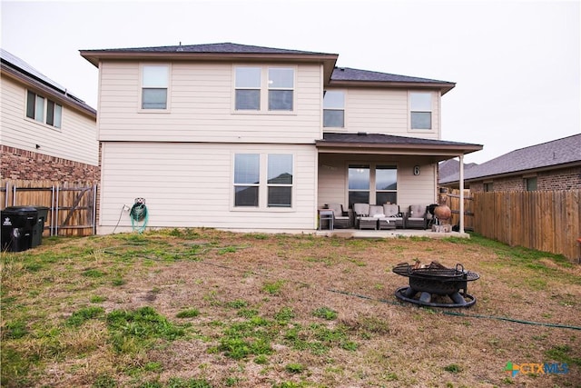 8915 Stonehollow Dr, Temple, TX 76502 - rear view of property featuring an outdoor living space with a fire pit and a patio