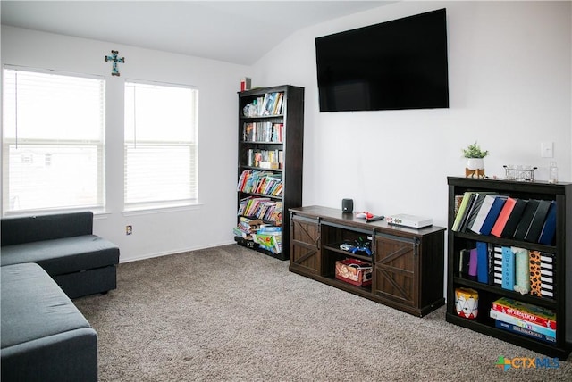 8915 Stonehollow Dr, Temple, TX 76502 - living room featuring carpet floors, lofted ceiling, and baseboards