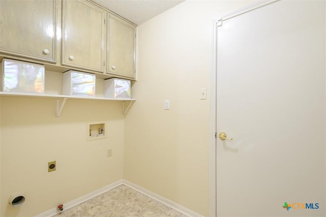 washroom with washer hookup, light floors, hookup for a gas dryer, cabinet space, and baseboards