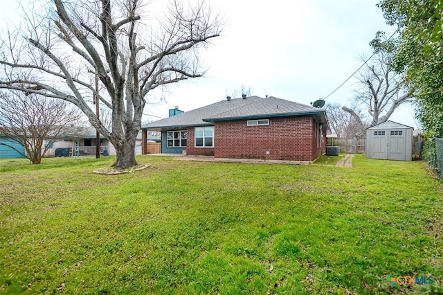 rear view of property with a fenced backyard, a storage shed, brick siding, an outdoor structure, and a chimney