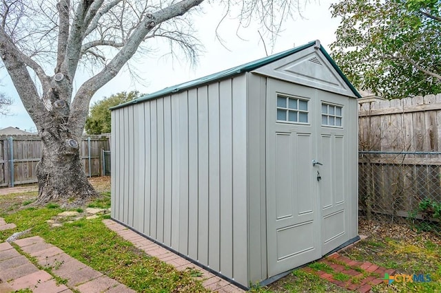 view of shed with a fenced backyard