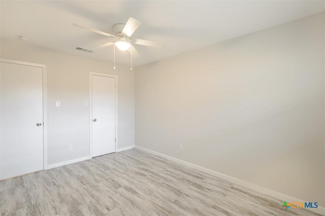 unfurnished bedroom with a closet, ceiling fan, and light hardwood / wood-style flooring