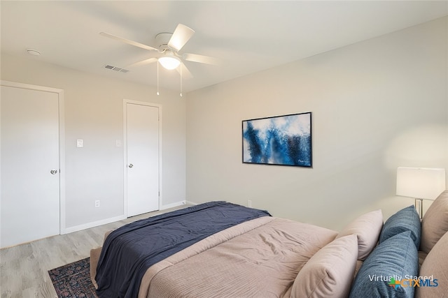 bedroom featuring ceiling fan and light wood-type flooring