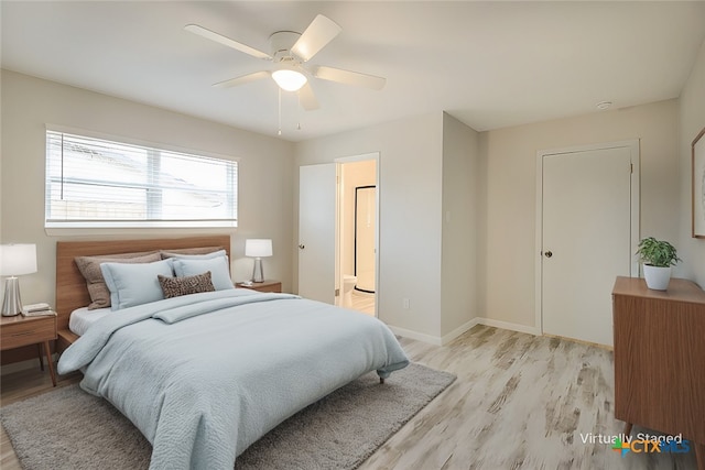 bedroom with light hardwood / wood-style flooring and ceiling fan