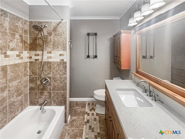 full bathroom with toilet, tile patterned floors, tiled shower / bath, vanity, and crown molding