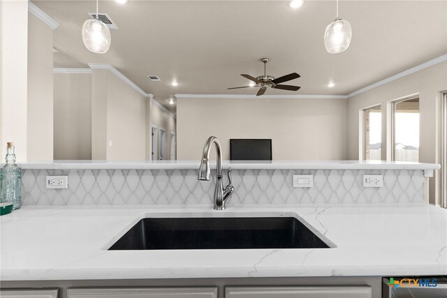 kitchen featuring appliances with stainless steel finishes, tasteful backsplash, light hardwood / wood-style flooring, crown molding, and gray cabinetry