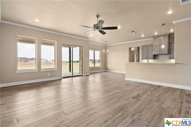 unfurnished living room featuring ceiling fan, crown molding, and light hardwood / wood-style flooring