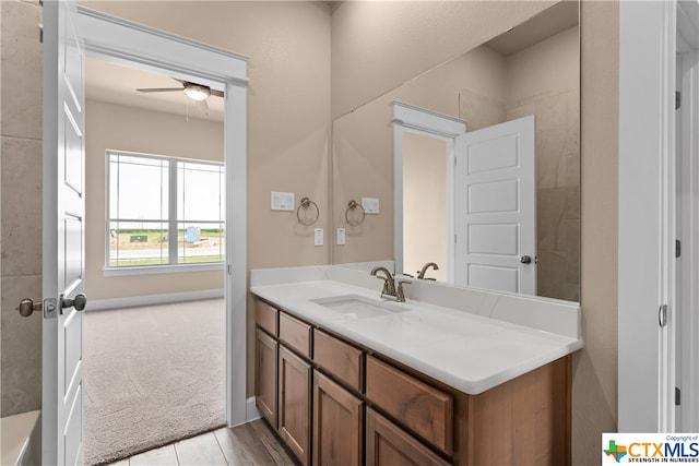 bathroom featuring vanity and ceiling fan