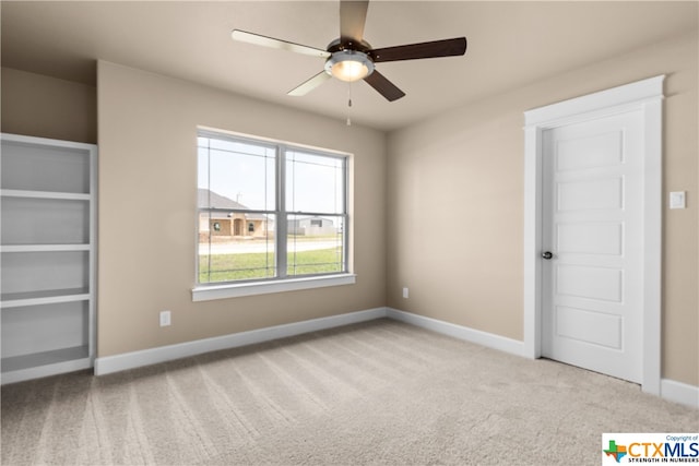 unfurnished bedroom with light colored carpet and ceiling fan