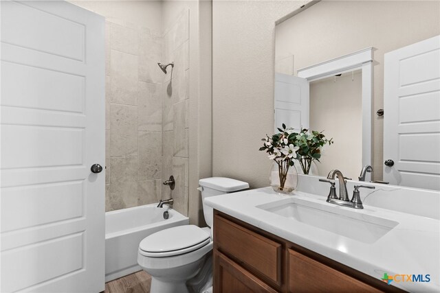 unfurnished bedroom with ceiling fan, light colored carpet, and connected bathroom