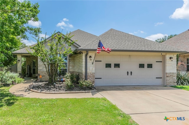 312 Ow Lowrey Dr, Salado, TX 76571 - view of front of house with a garage, driveway, roof with shingles, and brick siding