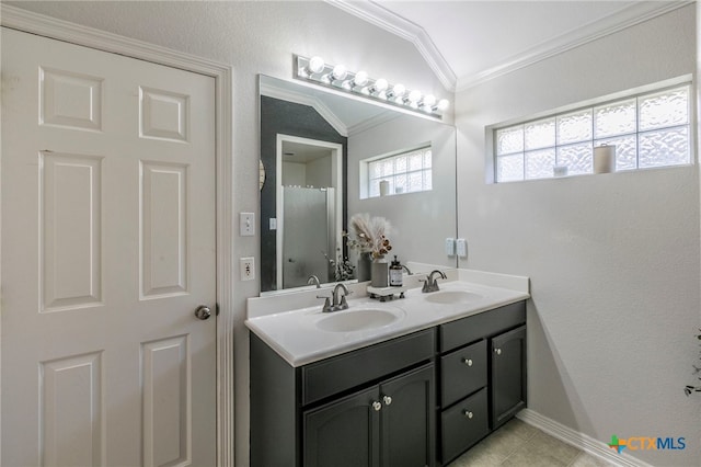 312 Ow Lowrey Dr, Salado, TX 76571 - full bathroom with crown molding, double vanity, tile patterned flooring, and baseboards
