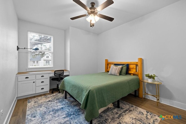 bedroom featuring dark hardwood / wood-style flooring and ceiling fan