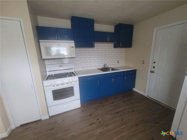 kitchen featuring blue cabinetry, white appliances, sink, and dark wood-type flooring