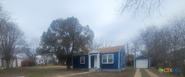 view of property exterior featuring an outbuilding and a garage