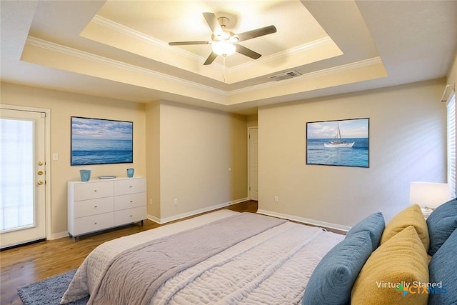 512 Gazelle Trl, Harker Heights, TX 76548 - bedroom with a tray ceiling, ornamental molding, wood finished floors, and a ceiling fan