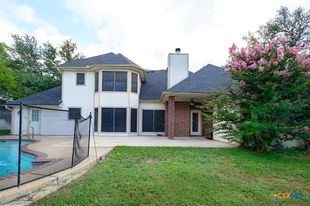 512 Gazelle Trl, Harker Heights, TX 76548 - back of property featuring a patio area, a yard, a chimney, an outdoor pool, and a shingled roof
