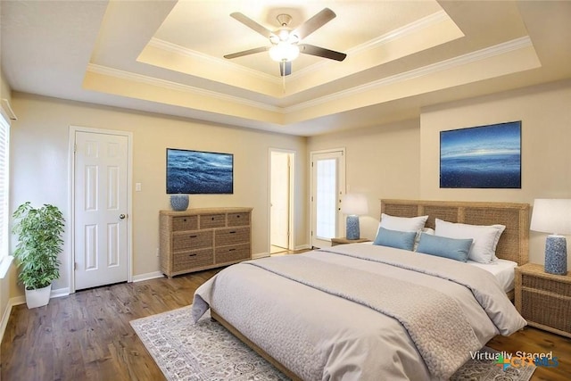512 Gazelle Trl, Harker Heights, TX 76548 - bedroom featuring a raised ceiling, wood finished floors, ornamental molding, and a ceiling fan
