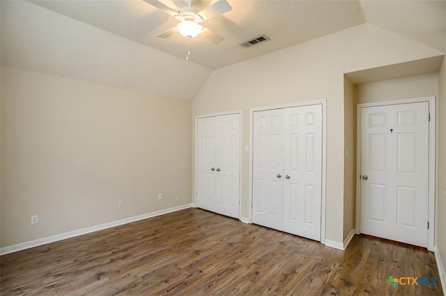 512 Gazelle Trl, Harker Heights, TX 76548 - unfurnished bedroom with vaulted ceiling, two closets, wood finished floors, and a ceiling fan
