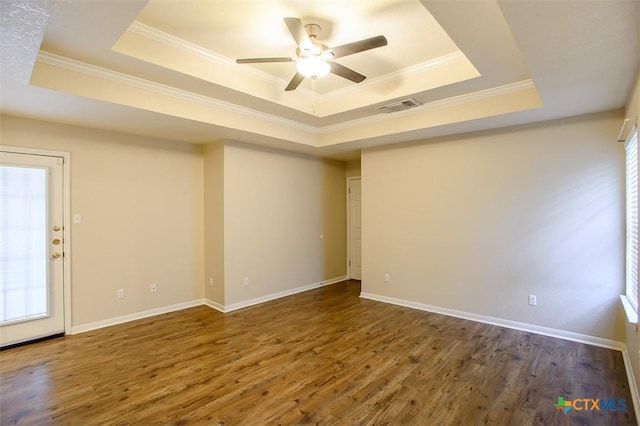 512 Gazelle Trl, Harker Heights, TX 76548 - spare room with a tray ceiling, wood finished floors, ornamental molding, and a ceiling fan
