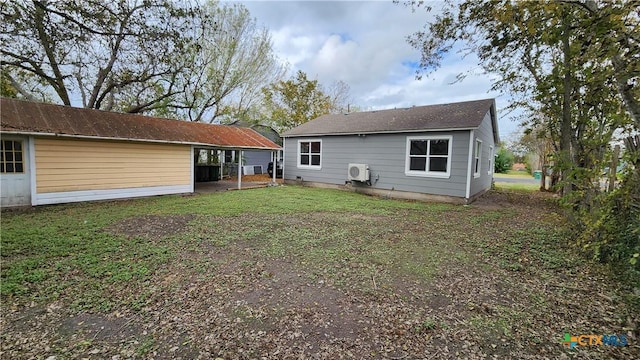 rear view of house with a lawn