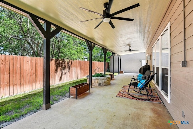 2258 Gruene Rd, New Braunfels, TX 78130 - fenced backyard with ceiling fan and a patio area